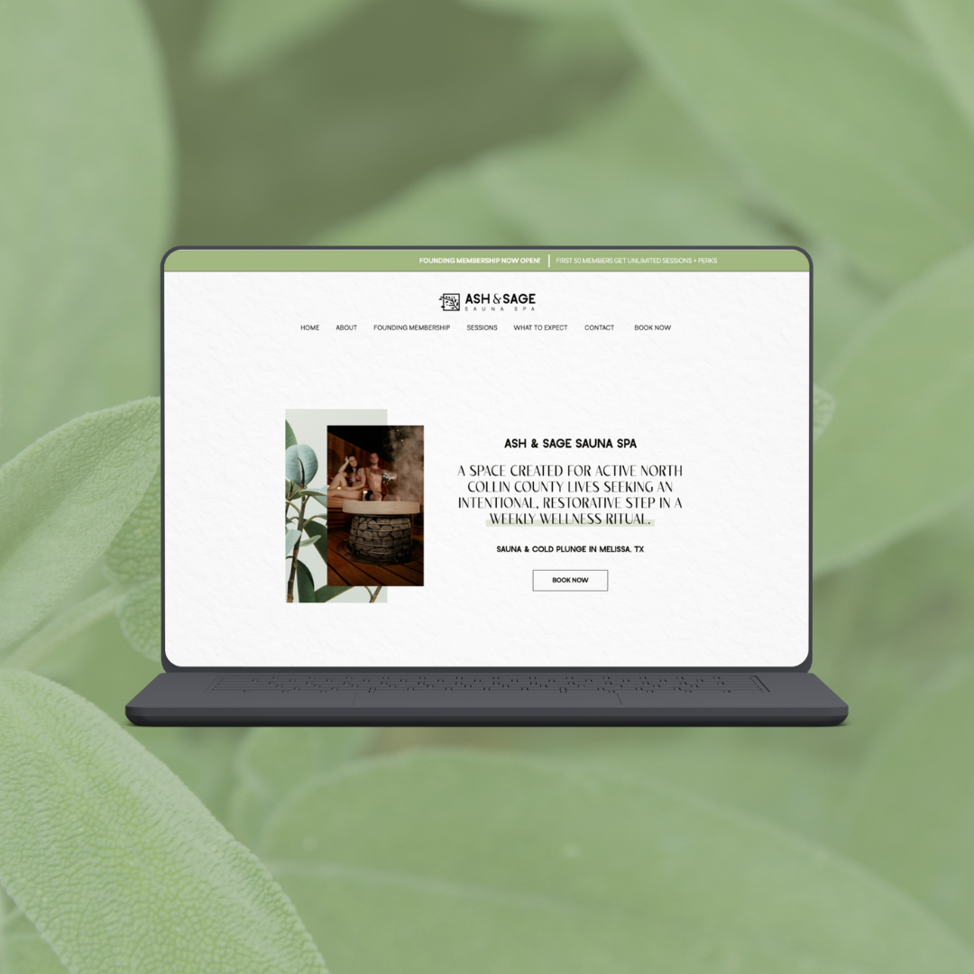 a laptop displaying the website for ash and sage sauna spa set against a green backdrop 