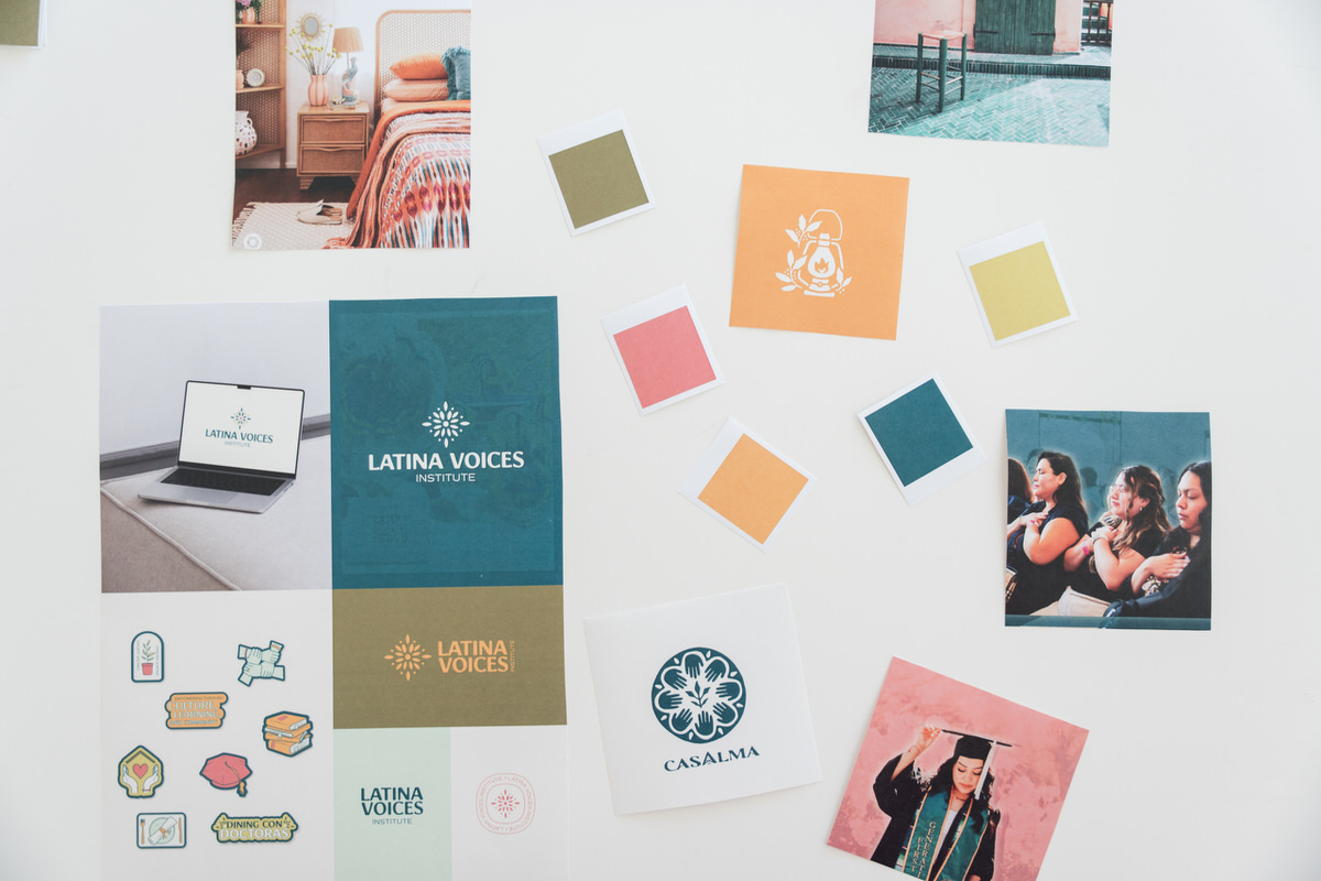 Color swatches, photos, and logo mockups all scattered around a table to help show the difference between a personal brand vs business brand